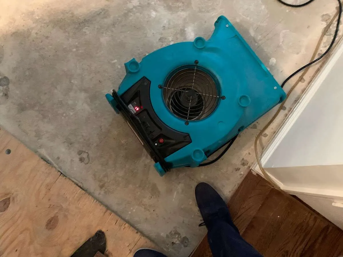 Air mover drying subfloor during Commercial Water Damage Restoration in Lauderdale Lakes