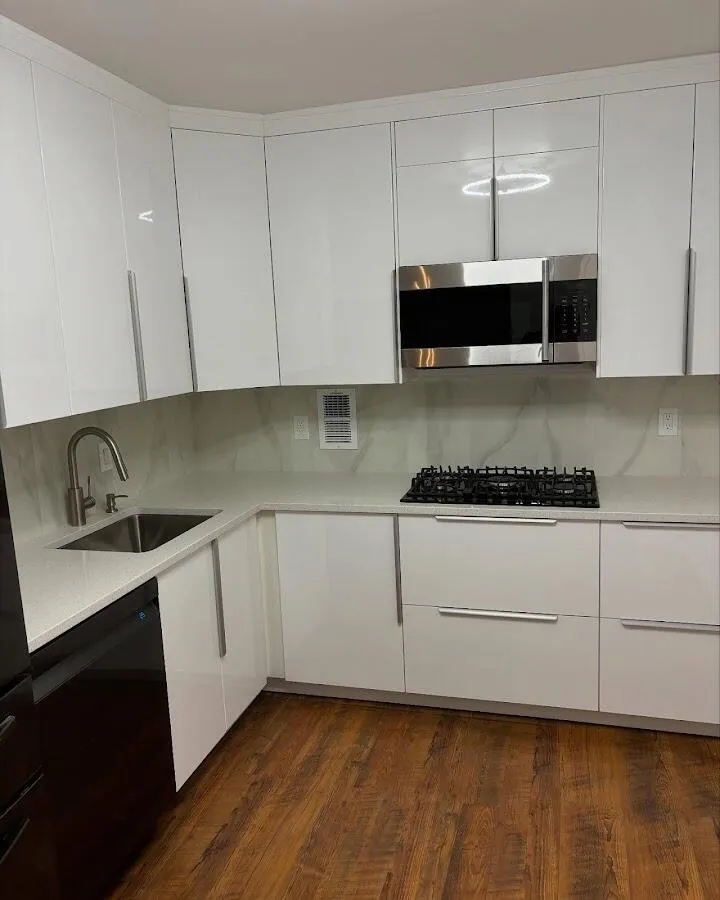 Restored kitchen with white cabinets after water damage in Lauderdale Lakes